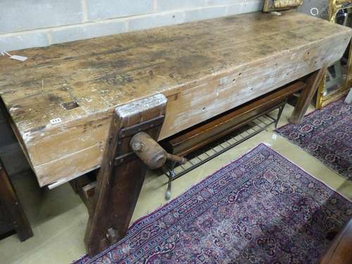 A 19th century pine workbench with original vice, W.244cm D....