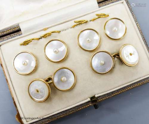 A cased six piece yellow metal (stamped 18), mother of pearl...