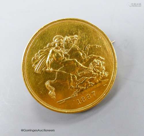 An 1887 £5 gold coin, now mounted as a brooch, gross 41.2 gr...