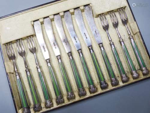 Six pairs of late Victorian stained ivory and silver fish ea...