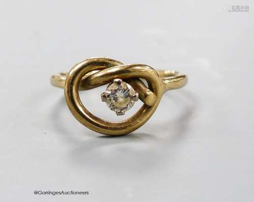 A 9ct gold and single stone diamond set 'knot' ring, size P,...