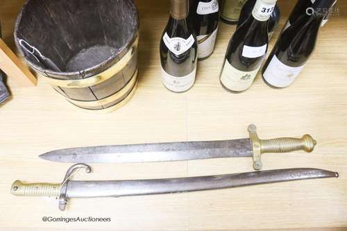 A bayonet and a 19th century French short sword, longest 71c...