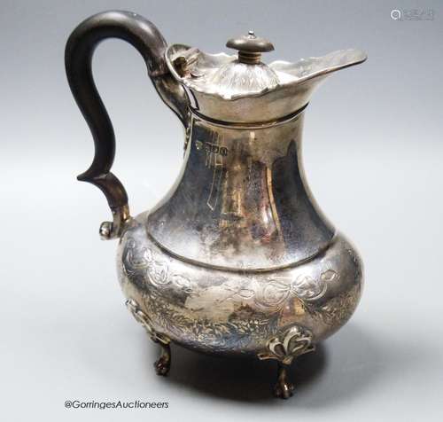 An Edwardian silver hot water pot, Goldsmiths & Silversmiths...