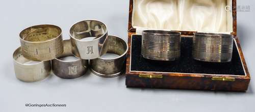 A cased pair of George V silver napkin rings, one other pair...