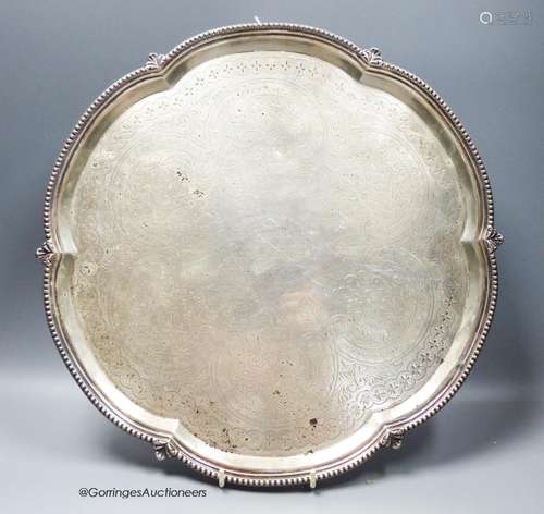 A late Victorian silver shaped circular salver, with engrave...