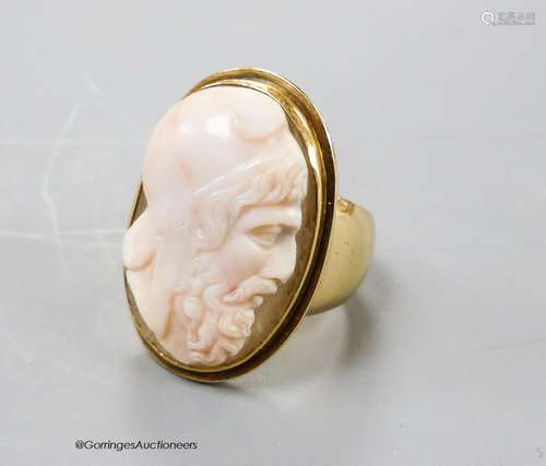 An antique yellow metal and oval cameo quartz? ring, carved ...