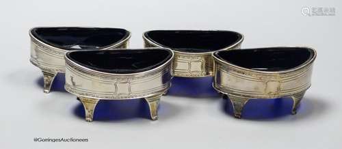 A set of four George III silver oval boat shaped salts, with...