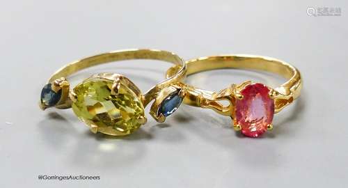 A modern 18ct gold and gem set dress ring and a similar 18k ...