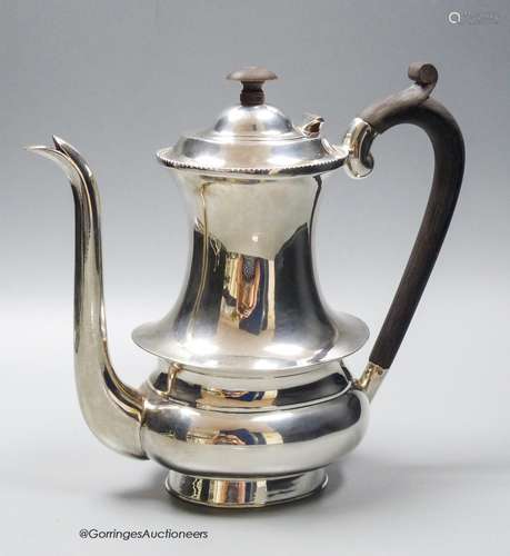 A white metal (stamped sterling silver) coffee pot, height 2...