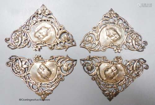 A set of four late Victorian pieced silver triangular mounts...