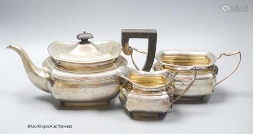 A George V silver three piece tea set by A&J Zimmerman & Co,...