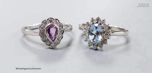 A modern 9ct white gold, pink sapphire and diamond cluster r...