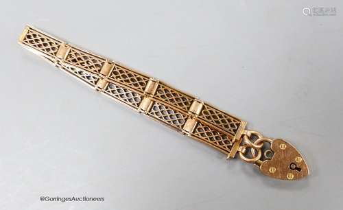 An early 20th century 9ct trellis work gate link bracelet, w...