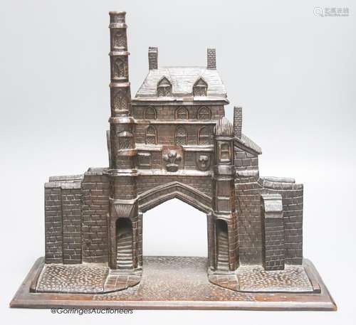 A 19th century carved oak model of a medieval Gatehouse, sta...