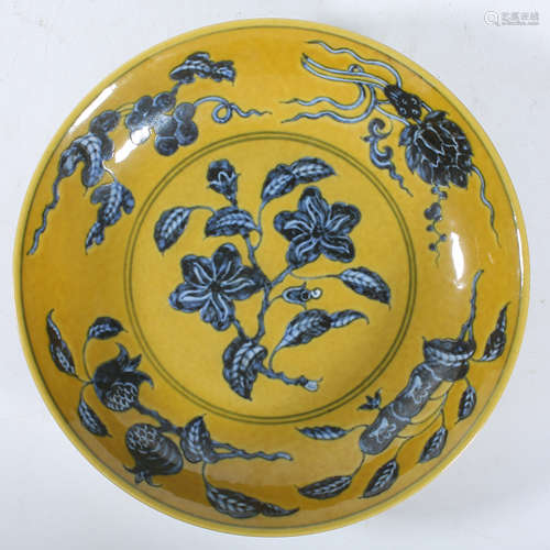 Blue and white flower pattern plate with yellow background i...