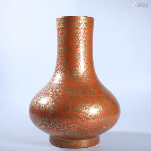 Gold colored bottle with red background in Qing Dynasty