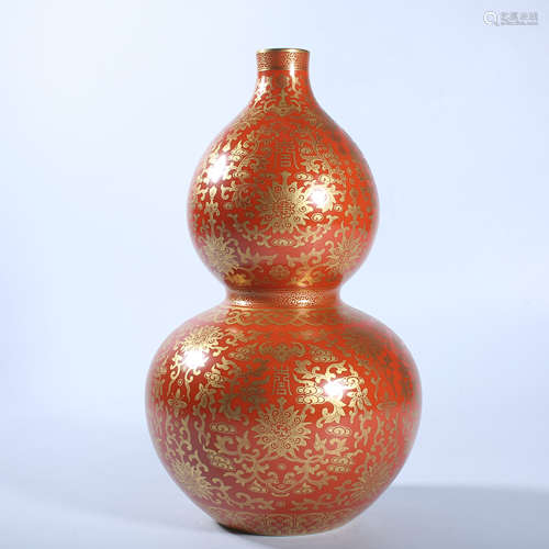 Gold colored gourd bottle with red background in Qing Dynast...