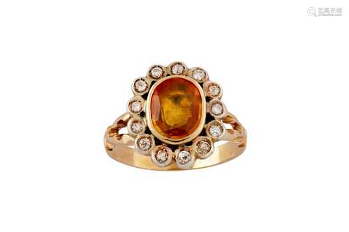 A yellow sapphire and diamond cluster ring