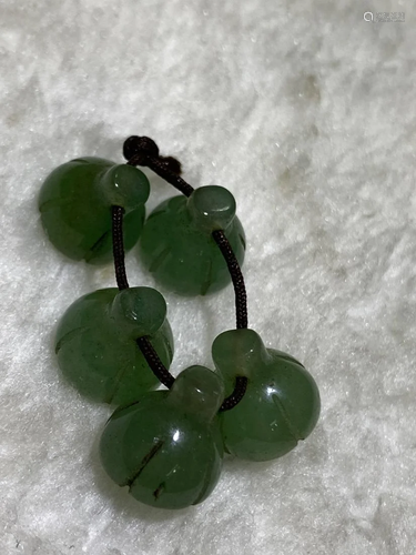 A STRING OF AVENTURINE CARVING BUTTONS