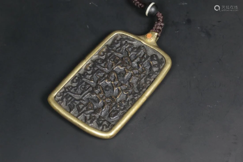 A TIBETAN BRONZE AMULET