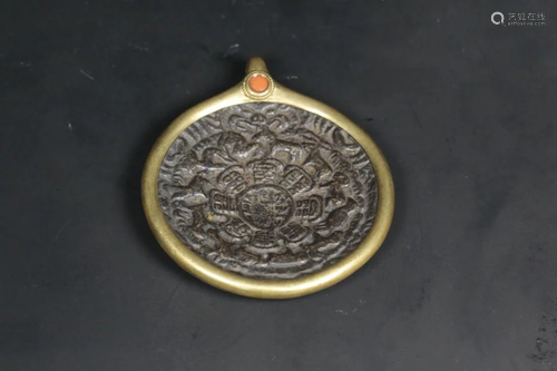 A TIBETAN BRONZE AMULET