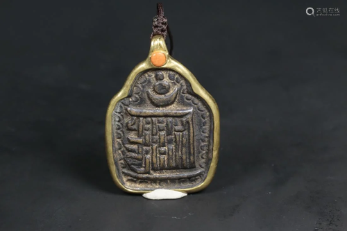 A TIBETAN BRONZE AMULET