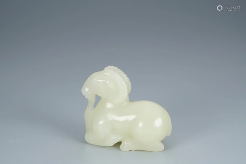 WHITE JADE CARVING OF A CROUCHING RAM