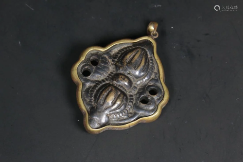 A TIBETAN BRONZE AMULET