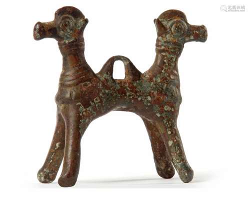 A BRONZE DOUBLE HEADED MYTHOLOGICAL ANIMAL, LURISTAN PERIOD,...