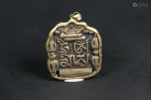 A TIBETAN BRONZE AMULET