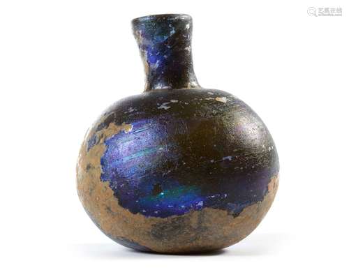 A BLUE ROMAN GLASS BOTTLE, 1ST-2ND CENTURY AD