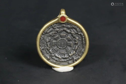 A TIBETAN BRONZE AMULET