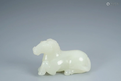 WHITE JADE CARVING OF A CROUCHING HORSE