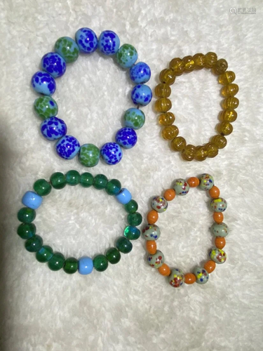 GROUP OF GLASS CARVING PRAYER'S BRACELETS.