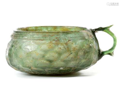 A GREEN SASSANIAN GLASS GOBLET, 1ST-2ND CENTURY AD