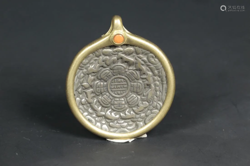 A TIBETAN GILT BRONZE AMULET