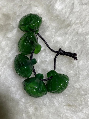 GROUP OF GREEN JADEITE CARVED BUTTONS