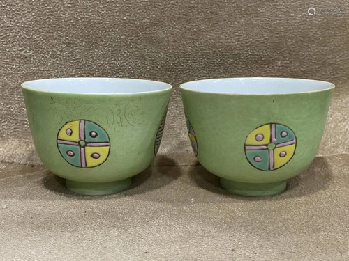 PAIR OF GREEN GROUND FAMILLE ROSE PORCELAIN CUPS