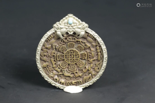 A TIBETAN SILER INLAID BRONZE AMULET