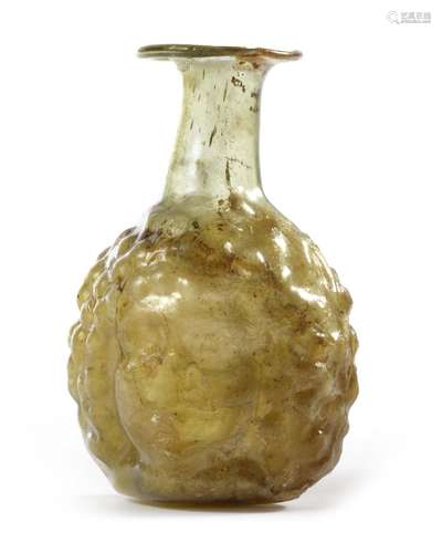 A ROMAN GLASS HONEYCOMB BOTTLE, 1ST-3RD CENTURY AD