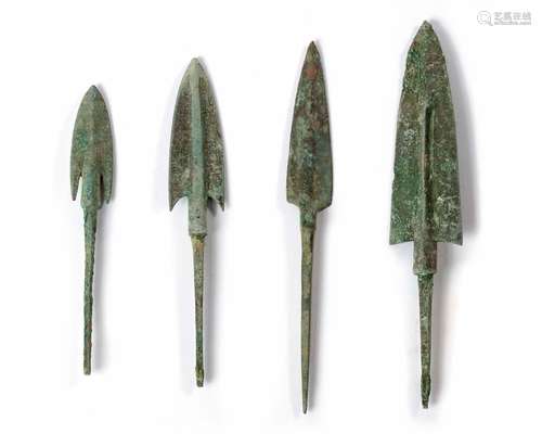 A GROUP OF FOUR BRONZE ARROWHEADS, ANCIENT NEAR EAST, 1ST MI...