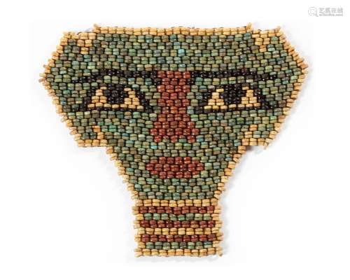 AN EGYPTIAN GLASS BEAD FACE MASK, 600-400 BC