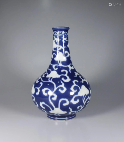 BLUE GROUND WHITE FLORAL PORCELAIN VASE