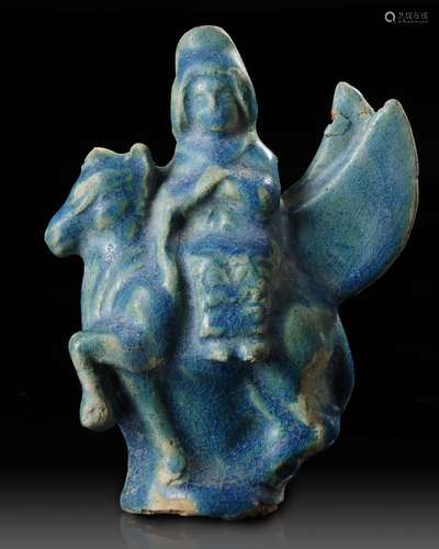 A SEATED FIGURINE ON A FLYING ANIMAL, RAQQA, SYRIA, 12TH-13T...