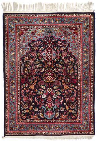 A SMALL KASHAN RUG, 1940