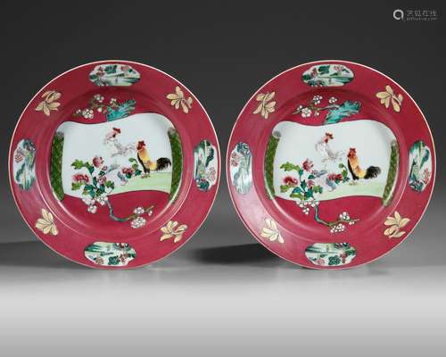 A PAIR OF CHINESE FAMILLE ROSE RUBY-GROUND SOUP-PLATES, QIAN...