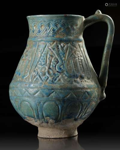 A TURQUOISE GLAZED POTTERY EWER, PROBABLY NISHAPUR, 12TH CEN...