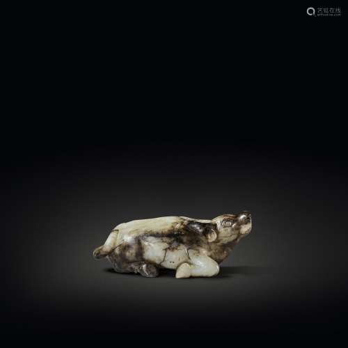 A beige and brown jade figure of a buffalo, Song - Ming dyna...
