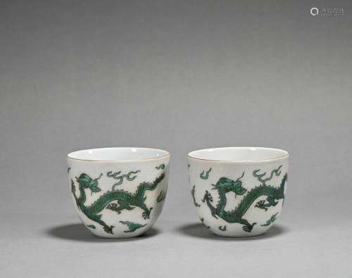 A pair of green glazed 'dragon' cup