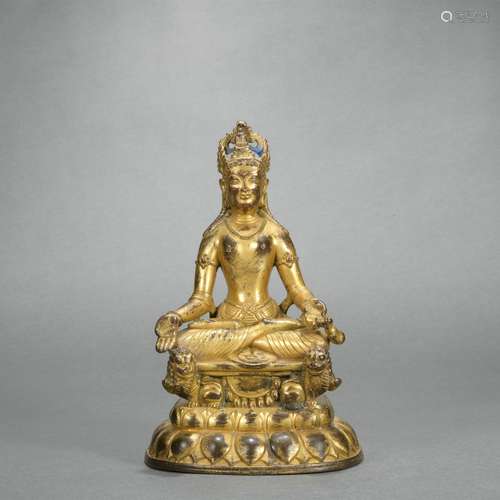 A gilt-bronze statue of Master Buddha